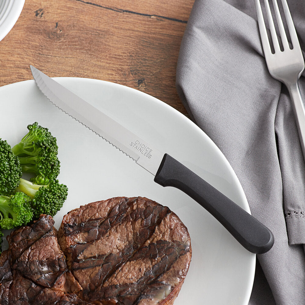 Choice 4¾" Stainless Steel Steak Knifes, Black Handle and Pointed Tip - 12 Pack