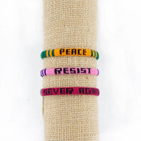 Thumbnail for Handmade Fair Trade PEACE, RESIST, NEVER AGAIN Woven Bracelet Trio